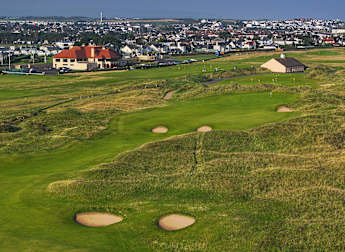 Who secured a spot into The Open at Royal Portrush via the Race to Dubai? 