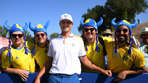 Ludvig Åberg stands alongside some Swedish fans