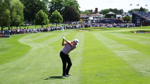 Justin Rose of England plays his second shot on the 9th hole during Day One