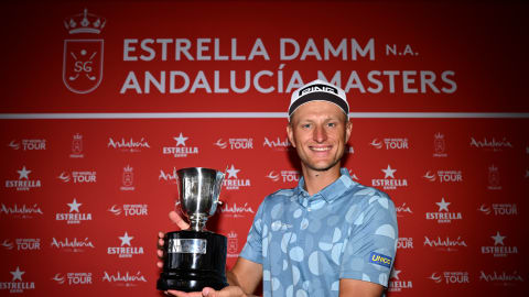 Adrian Meronk celebrates with the trophy after winning the Estrella Damm N.A. Andalucía Masters