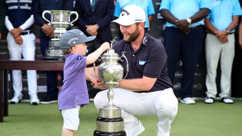 Branden Grace celebrates with his son after winning the South African Open 