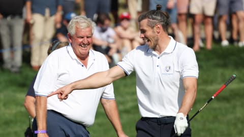Colin Montgomerie and Gareth Bale share a joke during the inaugural All-Star Match