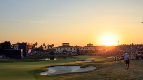 A view of the par-five 18th as the sun sets behind the clubhouse