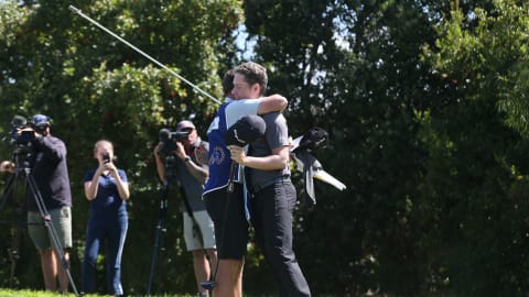 Anton Karlsson and his caddie celebrate after winning the RAM Cape Town Open