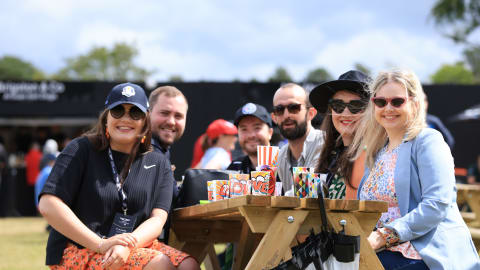 Fans enjoy the festival atmosphere in the Championship Village