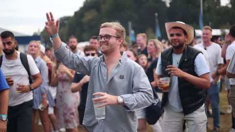 Crowds enjoy the music in the Championship Village