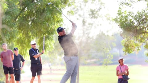 Shane Lowry of Ireland plays his second shot on the 12th hole during Day One