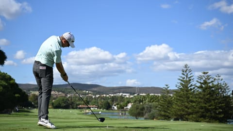 Marcus Helligkilde plays his tee shot on the 12th hole