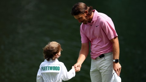 Tommy Fleetwood shakes hands with son Franklin