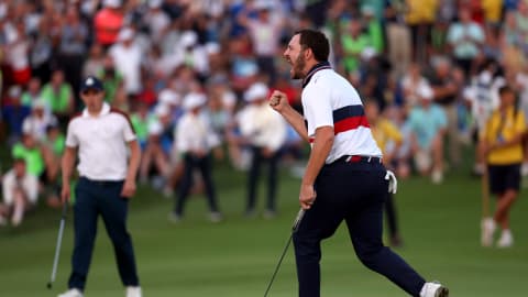 Patrick Cantlay celebrates holing a birdie putt on the 18th green to secure a point for the U.S. Team in Saturday's four-balls