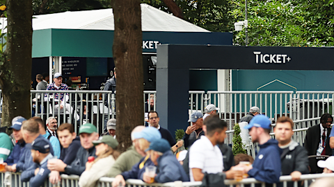 Fans enjoy refreshments in front of the Ticket+ area on the 14th hole