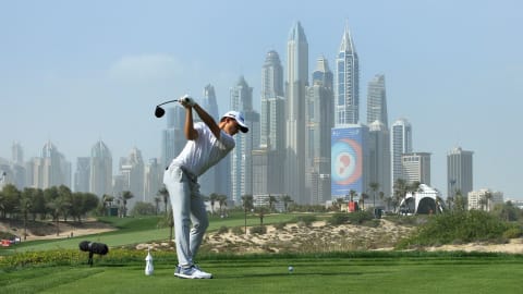 Rasmus Højgaard tees off with the Dubai skyline in sight