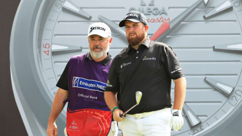 Shane Lowry and his caddie weigh up a decision