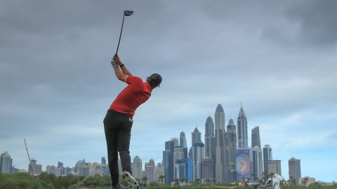 Thomas Pieters hits into the grey Dubai skyline