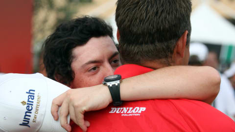 Rory McIlroy hugs Lee Westwood after finishing in second place in the 2009 Race to Dubai 