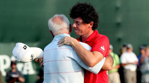 Rory McIlroy embraces his father Gerry after winning his second Major in 2012