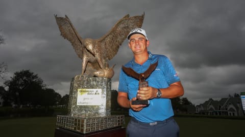Christiaan Bezuidenhout poses with his trophy after winning the Dimension Data Pro-Am
