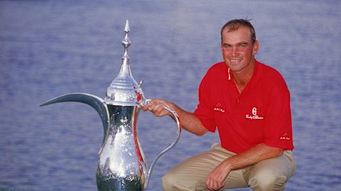 Thomas Bjorn with the 2001 Omega Dubai Desert Classic trophy