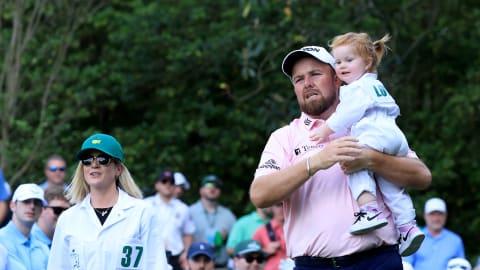 Shane Lowry carries his daughter Ivy