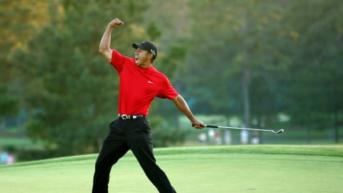 Tiger Woods celebrates holing a birdie putt on the 18th to win the 2005 Masters, defeating Chris DiMarco on the first play-off hole / Credit: Jamie Squire