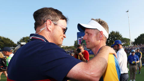US Team Captain Zach Johnson congratulates European counterpart Luke Donald 