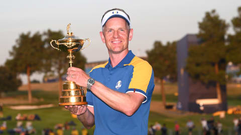 Luke Donald celebrates with the Ryder Cup trophy