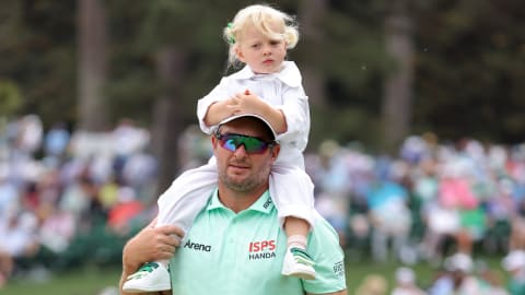 Ryan Fox carries his eldest daughter Isabel