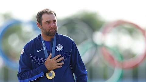 Scottie Scheffler is visibly emotional during the US national anthem after receiving his gold medal