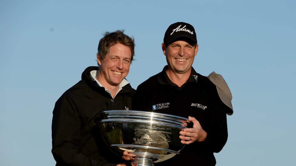 Hugh Grant and David Howell hold the Alfred Dunhill Links Championship trophy in 2013
