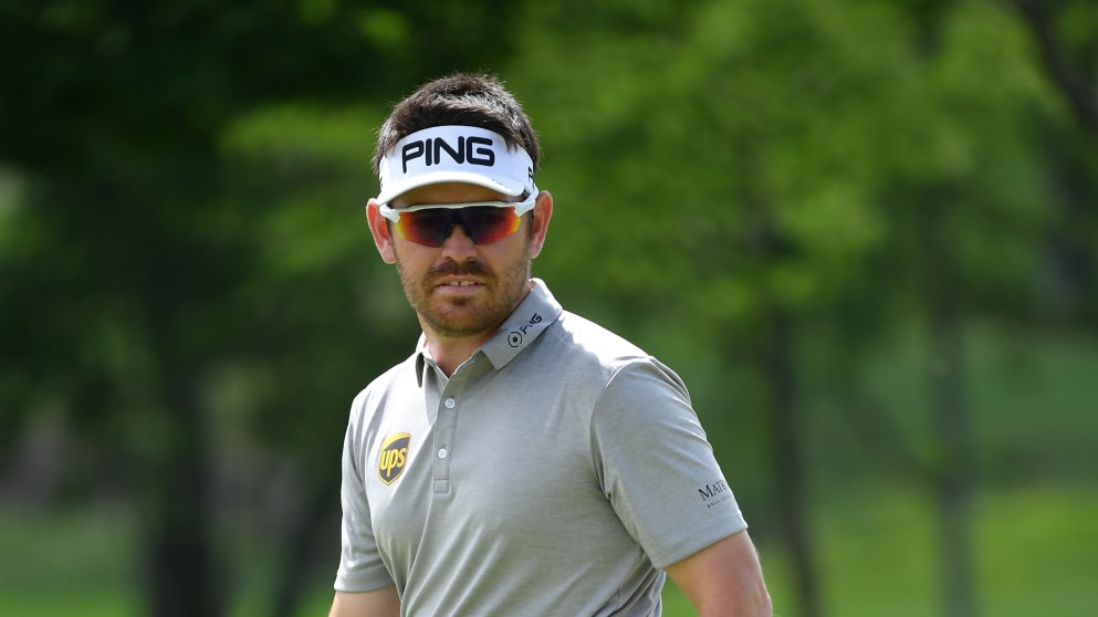 Louis Oosthuizen of South Africa watches a putt during the third round