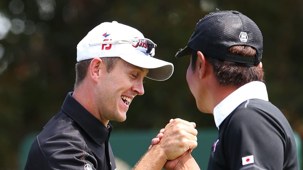 Stuart Manley (L) of Wales celebrates with Hideto Tanihara (R)