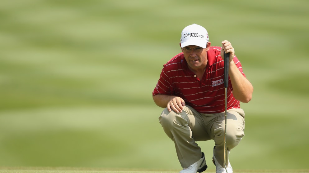 Padraig Harrington lines up a putt during the second round of the Maybank Malaysian Open 