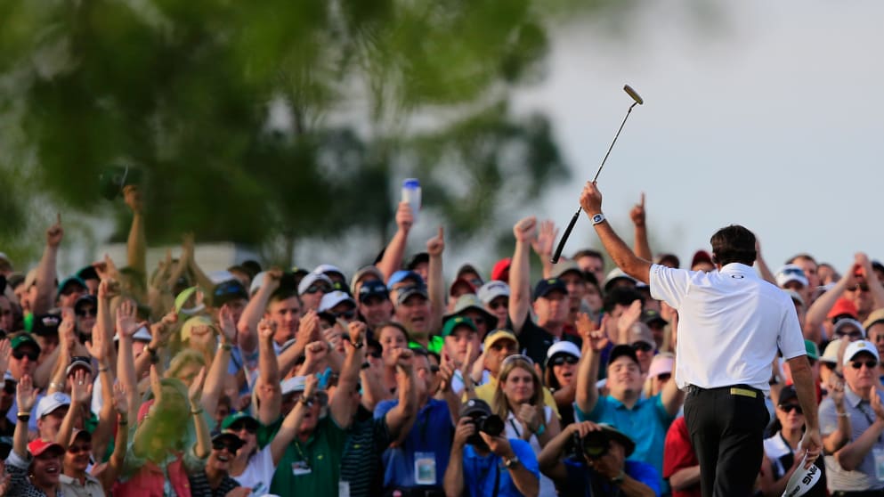 Bubba Watson celebrates on the 18th green after winning the 2014 Masters