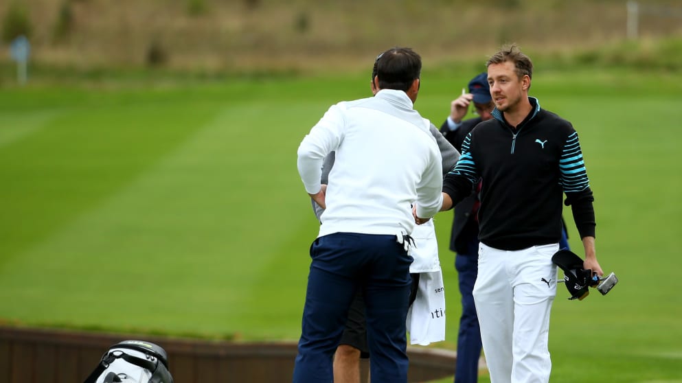 Jonas Blixt shakes hands with Paul Casey after defeating the Englishman at the first extra hole