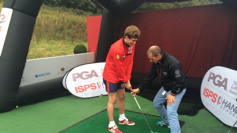 PGA Academy Coach, Craig Thomas, and a visually-impaired student  