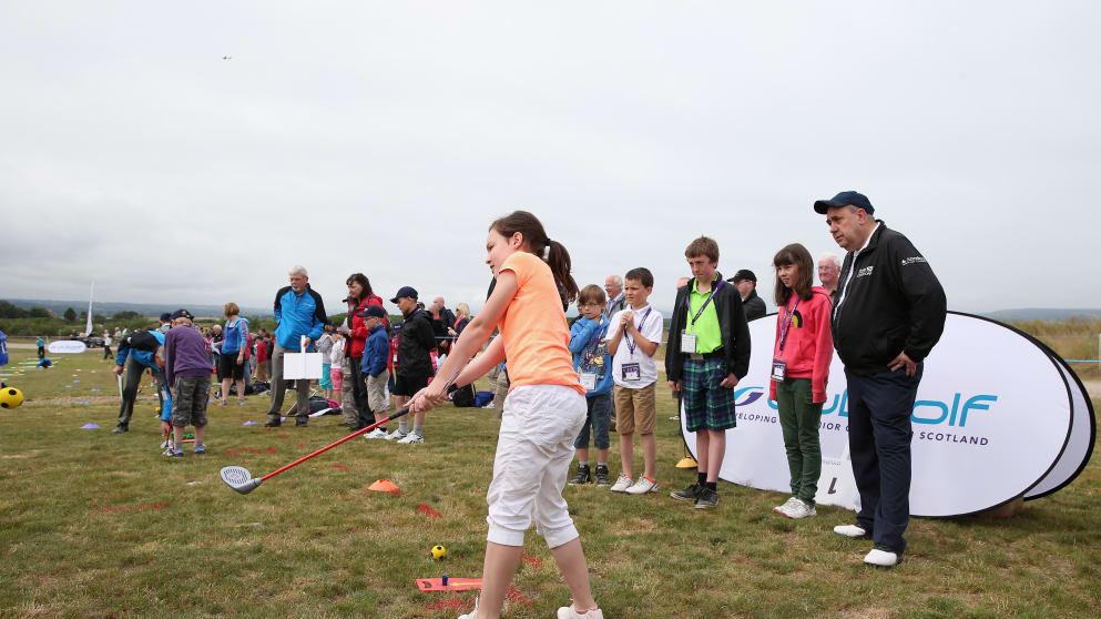 Scotland First Minister Alex Salmond looks on as children take part in The Big Chipping Challenge