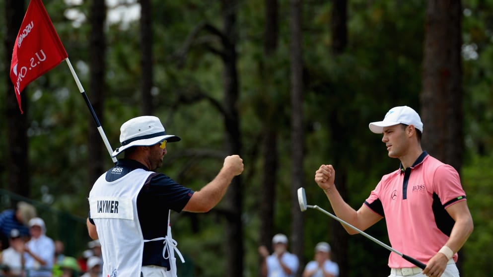 Martin Kaymer celebrates with his caddie Craig Connelly