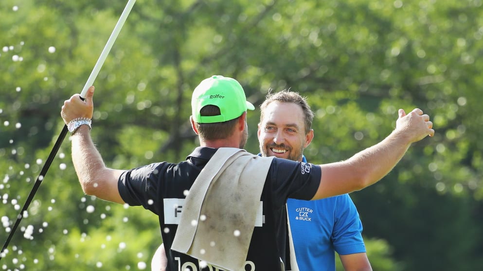 Darren Fichardt celebrates with his caddie after winning the Joburg Open