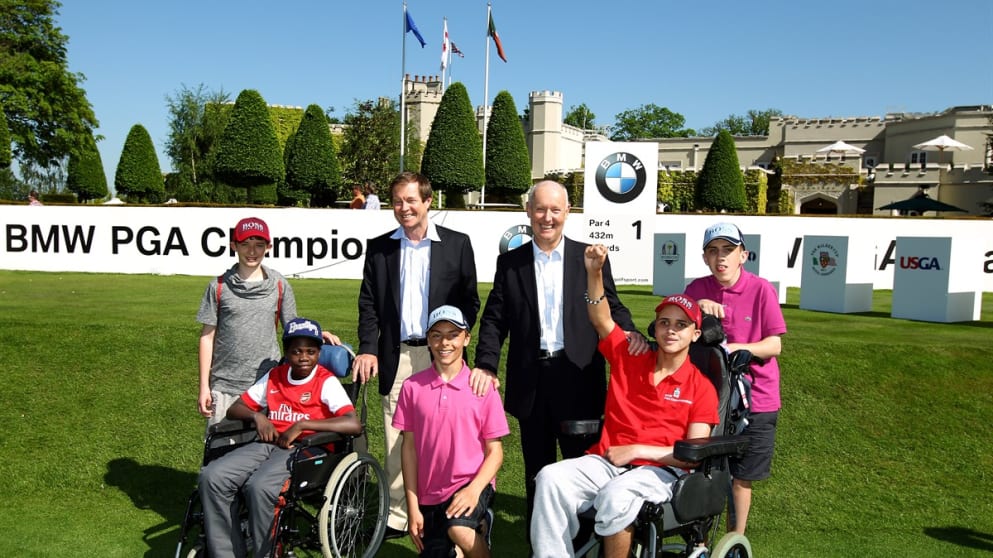George O'Grady and Managing Director of BMW UK, Tim Abbott meet kids from The Children's Trust 