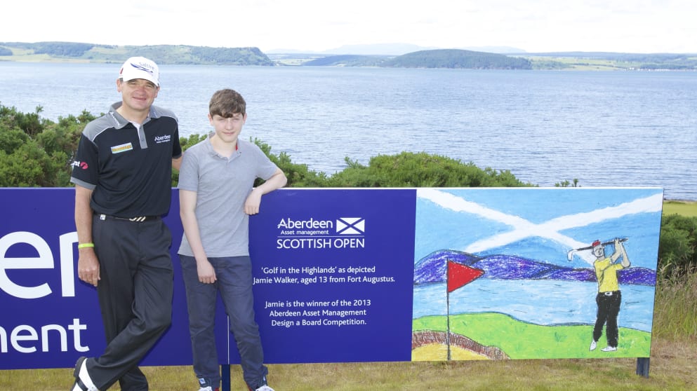 Paul Lawrie congratulates 13 year old Jamie Walker, winner of the 'Design a Board' competition