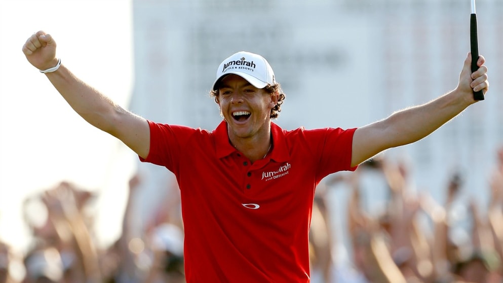 Rory McIlroy of Northern Ireland celebrates after holing his birdie on the 18th
