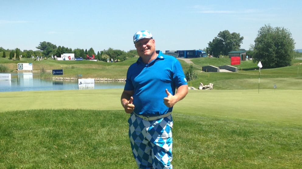 An amateur poses after his Pro-Am round with Jason Scrivener