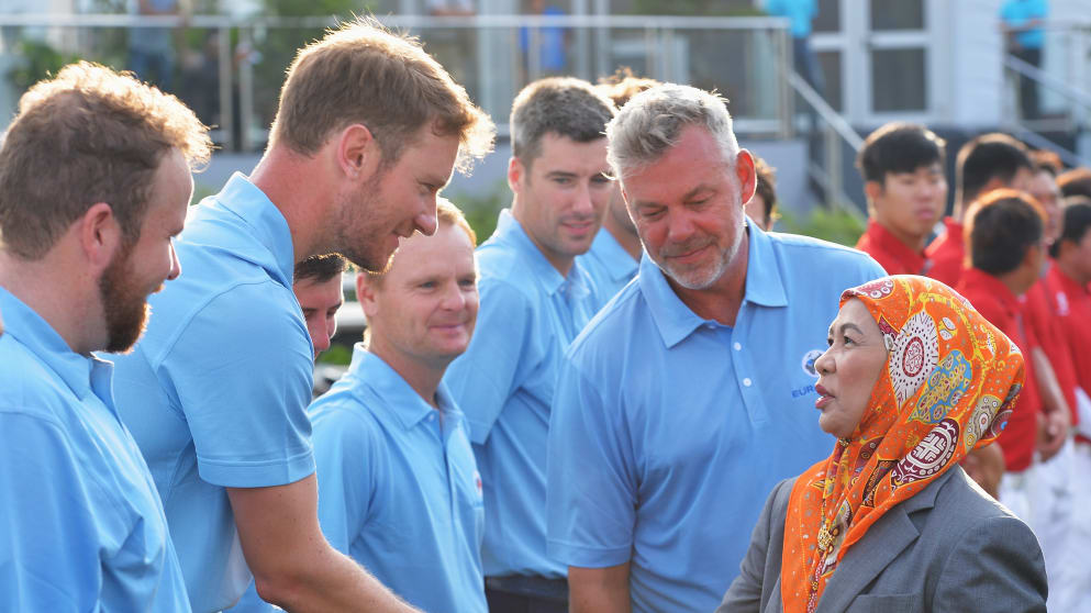 The Queen of Malaysia is introduced to Chris Wood by Darren Clarke, Captain of team Europe at the EurAsia Cup