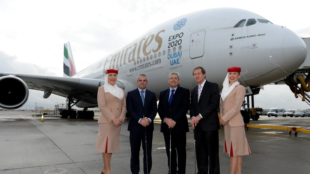 European Tour professional Paul McGinley, Nigel Hopkins, Executive Vice President, Service Departments of Emirates Group and George O'Grady, Chief Executive of The European Tour, are flanked by Emirates Cabin Crew
