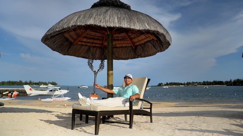 Kurt Kitayama - poses with the trophy after winning the AfrAsia Bank Mauritius Open