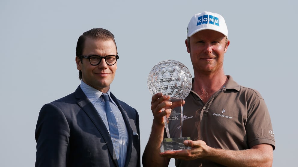 Prince Daniel, Duke of Vastergotland, the husband of Crown Princess Victoria of Sweden presents Mikko Ilonen with the trophy