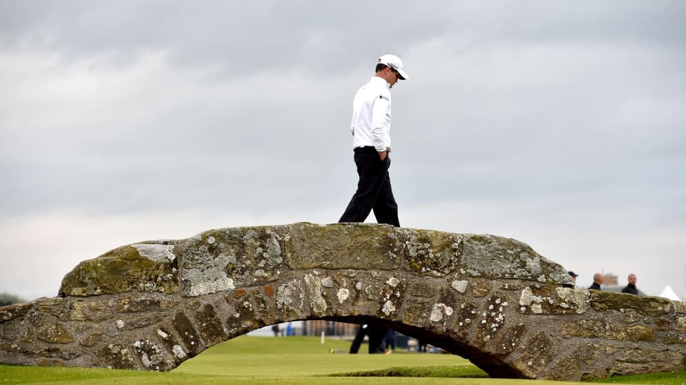 Zach Johnson  walks over the Swilcan Bridge on his way to victory