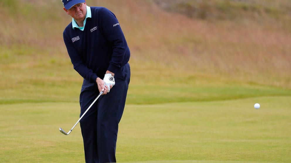 Colin Montgomerie of Scotland chips to the 9th green