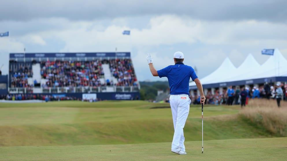 Justin Rose hits his second shot on the 18th hole