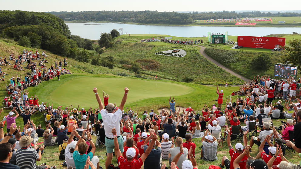 The crowd by the 16th green celebrate Robert Karlsson's hole in one